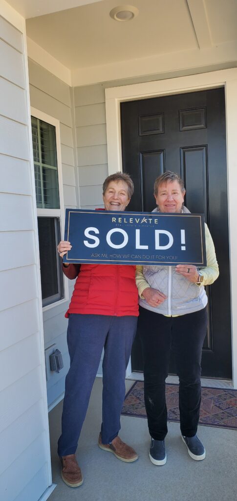 two satisfied customers who bought a home.