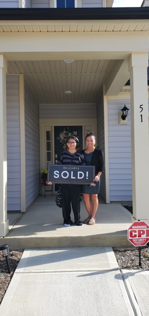 two happy customers who just bought a home.