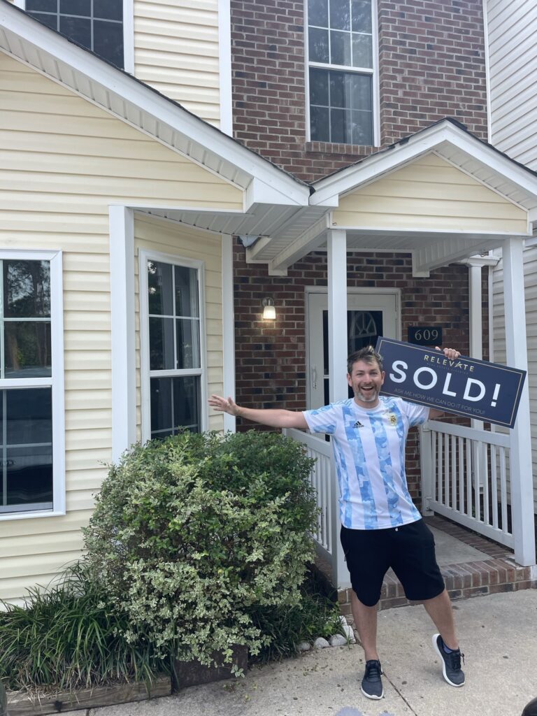Picture of satisfied customer who bought a home.