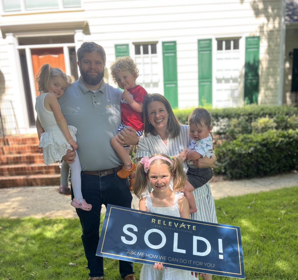 Happy family who just bought a house.